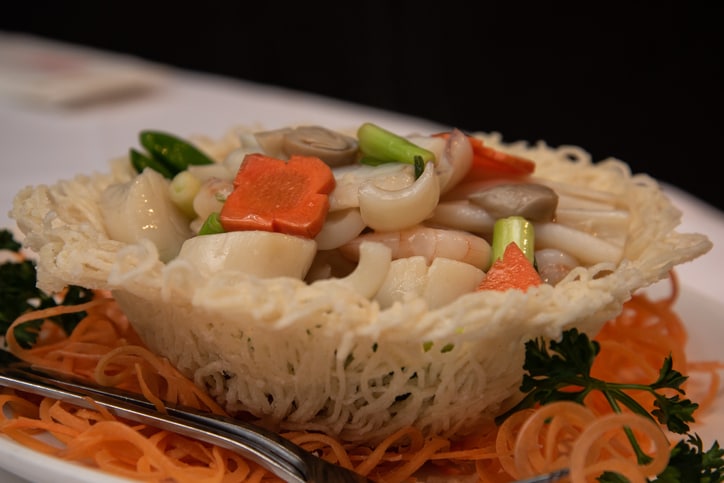 Seafood stir-fry in birds nest a popular dish in a Chinese restaurant