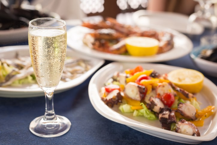 A glass of Prosecco sparkling wine with food