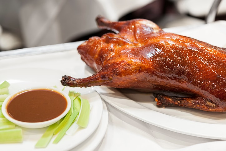 "Traditional Peking Duck served with thin pancakes, cucumber and plum or black bean sauce"