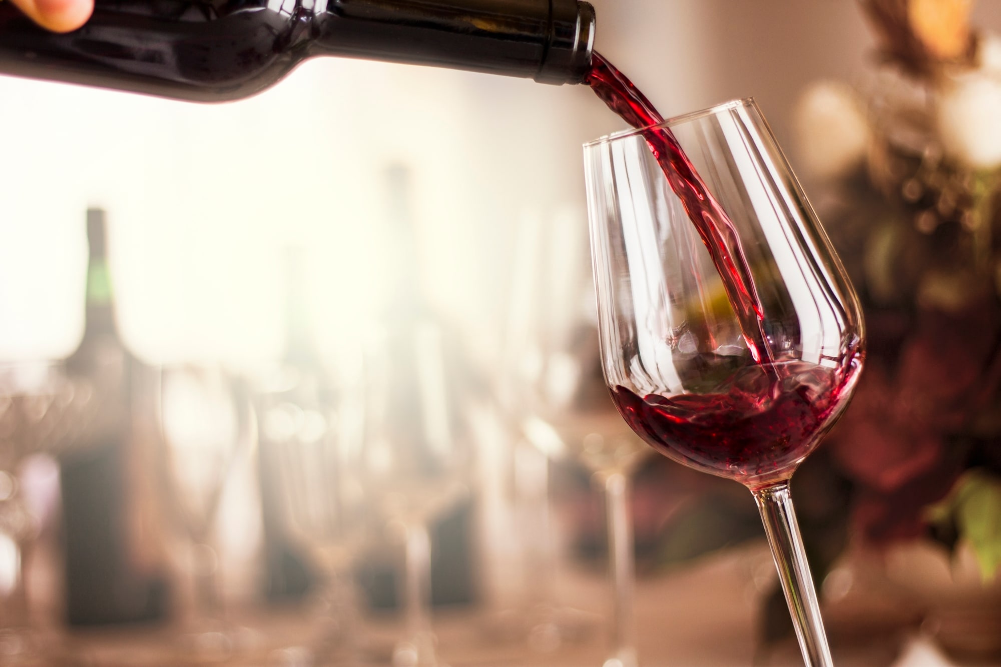 red wine pouring in a restaurant