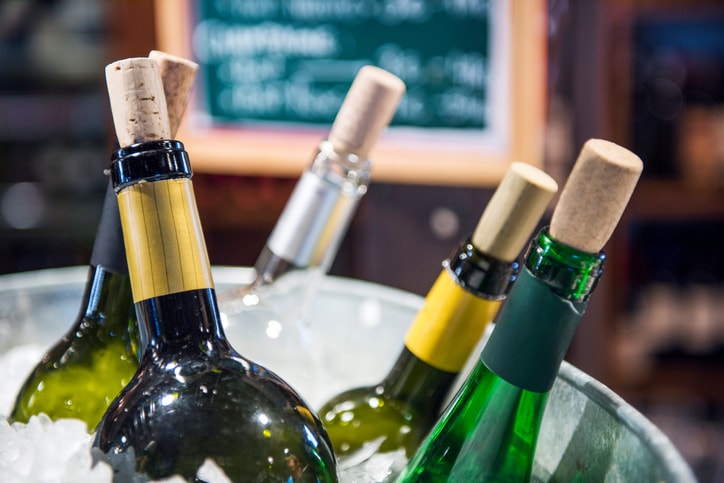 Wine bottles in ice bucket.